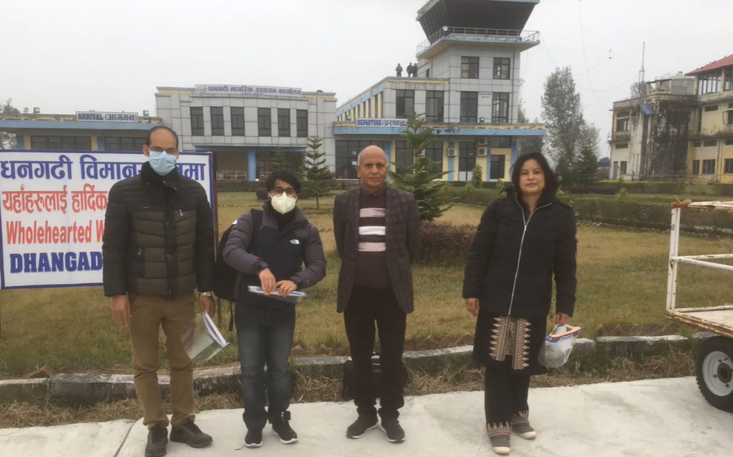 EATHEN project workers on field visit in front of a building